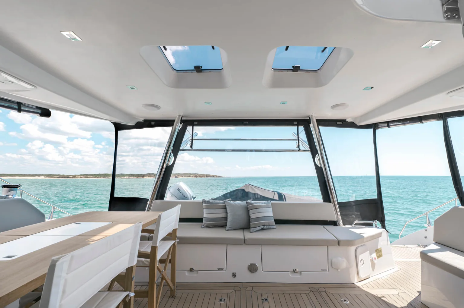 Shaded aft lounge aboard ANURA looking out to sea
